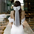 Elegant short white bridal veil with pearl bow accent for wedding photography and parties - White Bow Pearl Headpiece