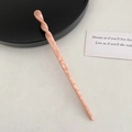 Detail of pink marble pattern hair stick with minimalist spiral twist design - Twisted Shape / Mermaid Pink