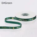 Dark green Christmas ribbon with gold Merry Christmas print and festive snowflake details - 1cm Gold Stamped Green 23 Yards