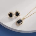 Close-up of gold necklace and earrings set with oval black stones and clear crystals - Gold Oval Black Zirconia (HQ0001(4))