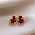 Macro detail of red flocked gourd earrings with golden edges and star diamond accents - Zirconia Inlaid Flocking Gourd Star Studs