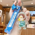 Blue astronaut liquid quicksand keychain with star charm and silicone wristlet strap - Ocean Astronaut-Moon