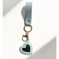 Detail view of light blue leather keychain with heart-shaped mirror and gold metal ring - Fresh Blue