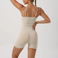 Beige ribbed seamless yoga bodysuit with skinny straps and scrunched butt lifting detail - Khaki