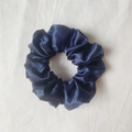 Satin fabric hair scrunchie in deep navy blue with a smooth silk-like glossy finish - Navy Blue