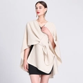 Fashionable beige oversized knit poncho cardigan with a unique front knot design for women - One Size / Beige
