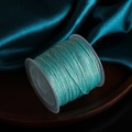 Lake blue 0.8mm polyester braided cord with metallic gold thread on a wooden tray - Light Blue