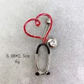 Spilla creativa a stetoscopio in lega rossa e nera, dimensioni 5,08x2,5cm, peso di 6g - Stetoscopio Argento