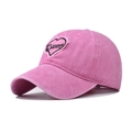 Detail of pink washed cotton baseball cap with embroidered Colorado heart patch - Pink with Pink Heart