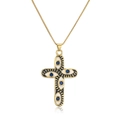 Macro shot of 18K gold plated cross pendant with blue zircon evil eye detail - Black White Enamel-Blue Gemstone (22414)