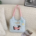 Detailed close-up of quilted tote with puppy embroidery and colorful button accents - Light Blue