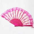 Close-up of pink lace dance fan with golden rose patterns and ornate plastic ribs - Rose Red