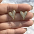 Gold heart stud earrings with sparkling cubic zirconia crystals held on fingertips - Small Gold