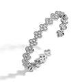 Detailed close-up of a silver clover leaf bangle with sparkling colorful crystals - Platinum White Zirconia Clover Bangle