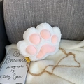 Cute white plush cat paw crossbody bag with pink pads and gold chain strap on soft sofa - White