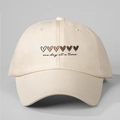 Detail of cream baseball cap featuring gradient hearts and 'one day at a time' text - One Size / Beige