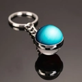 Solar system double-sided glass ball keychain featuring a blue planet design - Uranus