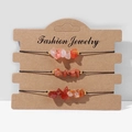 Set of three handmade red agate stone bracelets with adjustable black cords on a display card - FK0049 Red Agate Color Crushed Stone Set