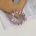 Elegant light purple satin scrunchie with soft pleated texture for hair styling - Nude