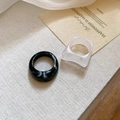 Detail of two minimalist acrylic resin rings with ink and frosted marble texture - Black-White (2-Piece Set)