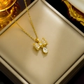 Goldene Schleifen-Halskette mit Zirkonia-Anhänger in einer luxuriösen Geschenkbox - Goldene Wassertropfen Schleife Halskette (335)