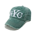 Detailed macro view of vintage olive baseball cap showing frayed NYC embroidery and fabric - M (56-58cm) / Green