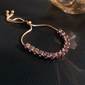 Detail of rose gold tennis bracelet with purple zircons and adjustable sliding clasp closure - Purple