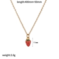 Detail view of a gold chain necklace featuring a red and green strawberry pendant - Gold White Dotted Strawberry Necklace Style (TN60539)