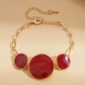 Golden bracelet with red round enamel pendants and textured edges for women - Bracelet / Red