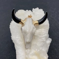 Cow skull pendant with black horns and golden accents on a white crystal cluster base - No.9 White with Black Horns
