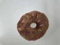 Brown plush donut dog toy with colorful embroidered sprinkles and a central hollow design - Coffee Donut