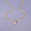 Gold snake chain necklace with a rectangular clear emerald-cut crystal pendant - White Zirconia Rectangular Gem / Gold-White Zircon