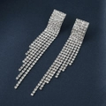 Silver bridal tassel earrings with sparkling rhinestones on a textured blue background - Long Tassel Dangle Earrings