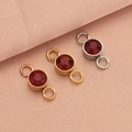 Macro view of three stainless steel birthstone charms in rose gold, gold, and silver - Dark Red (Silver Color)