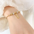 Elegante gouden kralenarmband met een met strass steentjes ingelegde letter I-hanger - Gouden Armband - Letter I