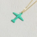 Fashionable golden necklace featuring a turquoise blue airplane pendant in vibrant paint finish - Green (XL2377)
