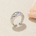 Close-up of polished silver wide ring with irregular surface and inlaid zircons - Adjustable Open / Silver Wide Zirconia
