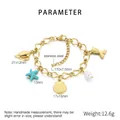 Dettaglio del bracciale in acciaio inossidabile placcato oro 18k con ciondoli marini - Stile Stella Marina Conchiglia Coda di Pesce (KB204437-SXSJ)