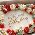 Golden Merry Christmas acrylic cake topper on festive red and green cream holiday cake - Mirror Gold