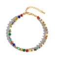 Handmade bohemian style bracelet with colorful natural stones and golden spacer beads - Colorful