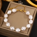 Detail of baroque pearl bracelet with gold beads and lobster clasp on silk fabric - Gold Baroque Pearl Bracelet (JM790)