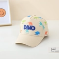 Détail de la casquette enfant beige avec motifs dinosaures et broderie DINO bleue - 52cm (2-5 Ans) / Blanc Cassé