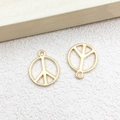 Two golden peace sign metal pendants for DIY jewelry making on white background - 1pc Round Peace Symbol Charm