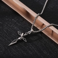 Detail of silver cross pendant with black enamel inlay and sturdy box chain on dark base - XL09 / Layered Cross / Silver Black