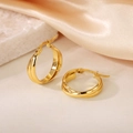 Detail of 18K gold-plated interlocking geometric double hoop earrings on silk background - 20mm (PJER368) / Gold