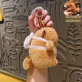 Brown Capybara plush keychain with white backpack and rotating pull-string tail - Pull String Moving Tail Capybara