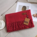 Solid red cashmere-feel scarf with elegant fringes and premium leather brand label - Jujube Red