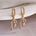 Elegant gold bow earrings with teardrop cubic zirconia pendant for a stylish look - Bowknot Water Drop Earrings / Gold