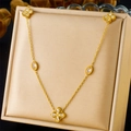 Golden stainless steel necklace featuring diamond-encrusted four-leaf clover pendants - Three Clover Pendants Style (N3103)