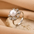 Adjustable silver ring with white pearl center and zircon halo on textured stone - Silver Sun Pearl Ring (M-511)